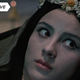A woman with a daisy crown looks offscreen with fear in 1967's Viy.